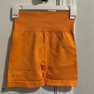 Orange biker shorts (size small)